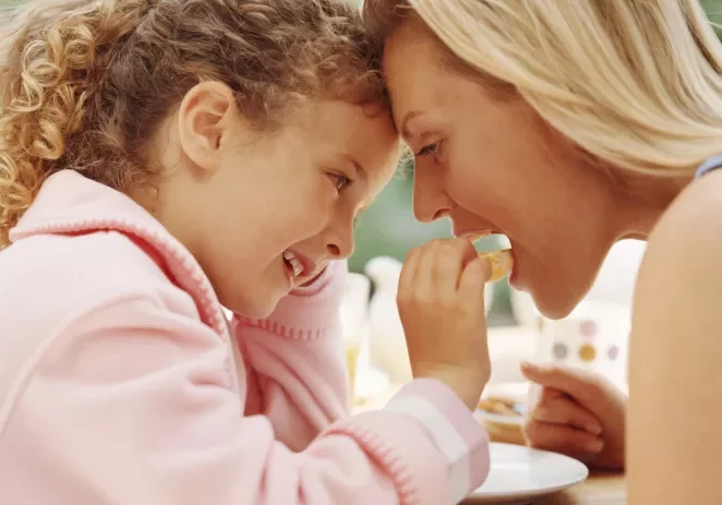 Women and baby having fun